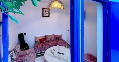 a room with a couch and a table at Couloirs de la Médina in Marrakech