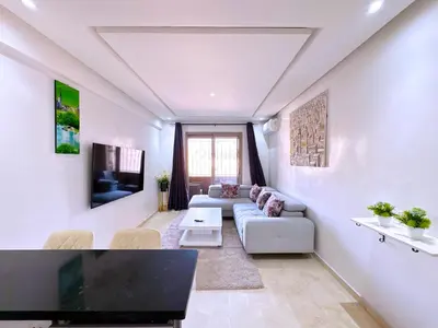 a living room with a couch and a table at Cosy Hyper centre Bd Hassan 2 in Marrakech