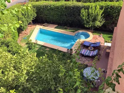 an overhead view of a swimming pool in a yard at Riad sofia in Marrakech
