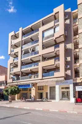 a large apartment building on a city street at NEW! Plein Gueliz, wifi, terrasse in Marrakech