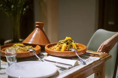 a table with two bowls of food on it at Riad Bab Aljana in Marrakech