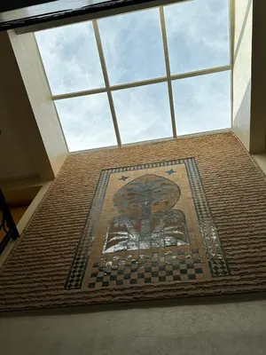 a room with a mosaic floor with a window at Riad Jad - Sweet Duplex Appartement in Marrakech