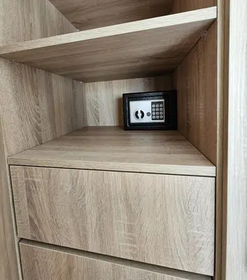 a clock sitting on a shelf in a closet at Coeur de Marrakech : Luxe, ciné & confort in Marrakech