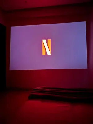 a computer screen with aletter n on it in a room at Coeur de Marrakech : Luxe, ciné & confort in Marrakech