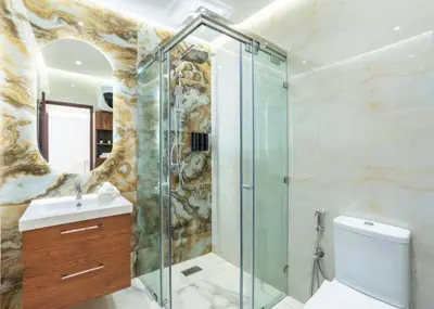 a bathroom with a shower and a toilet and a sink at Coeur de Marrakech : Luxe, ciné & confort in Marrakech