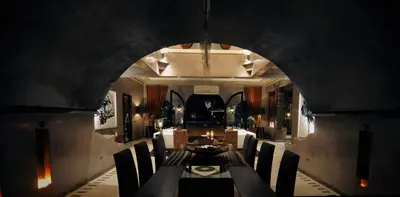 a dining room with a long table and chairs at Villa Malika Silvana in Marrakech