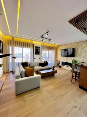 a living room with a couch and a table at Appartement Marrakech Hivernage N37 RESIDENCE CAPRICE PALACE in Marrakech
