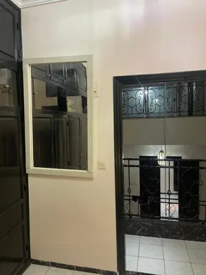 a room with a door and a window and a balcony at Riad Aya in Marrakech