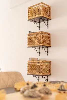 four wicker baskets hanging on a wall at Appartement centre Marrakech gueliz - Cool & Cozy Apartment for a Family Stay in the Heart of the City in Marrakech