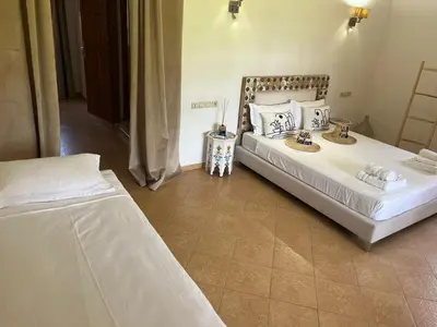 a bedroom with two beds in a room at Villa Keshmere in Marrakech