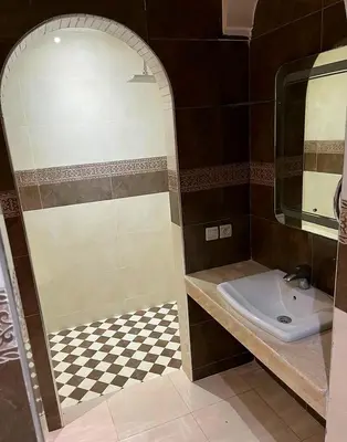 a bathroom with a sink and a mirror at Villa Keshmere in Marrakech