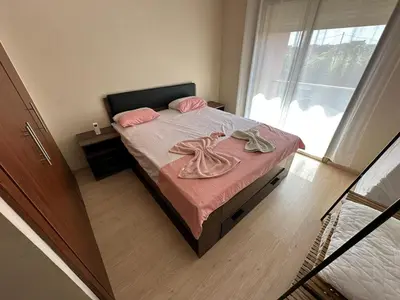 a bedroom with a bed with pink sheets and pink pillows at Appartement avec Piscine Prestigia Agate Marrakech in Marrakech
