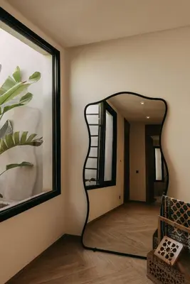 a mirror on a wall in a room at Villa Ayani in Marrakech