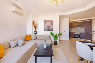 a living room with a couch and a table at New, Appartement Miramas à Gueliz,en plein centre ville in Marrakech