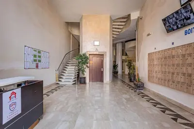 a hallway of a building with a door and stairs at New, Appartement Miramas à Gueliz,en plein centre ville in Marrakech