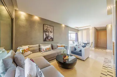 a living room with a couch and a table at Relax Front Of Golf-Atlas in Marrakech