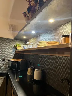 a kitchen with a counter top with a microwave at Loft Gueliz in Marrakech