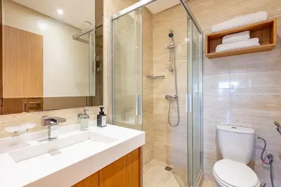 a bathroom with a toilet and a sink and a shower at PO 10 Appartement de luxe, golf, piscine & club house in Marrakech