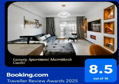 a living room with a bed and a couch at Gueliz Luxury Apt with Pool Self Check In 24 7 Security in Marrakech
