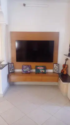 a flat screen tv sitting on top of a wooden bench at Calm Cosy Villa in Marrakech