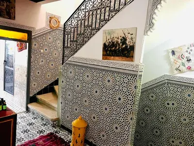 a staircase with a tiled floor and a stair case at Al Bahja family in Marrakech