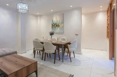 a dining room with a table and chairs at Red City Rendezvous – Downtown in Marrakech