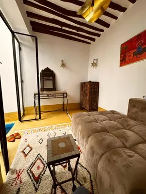 a living room with a couch and a table at Little 24 in Marrakech