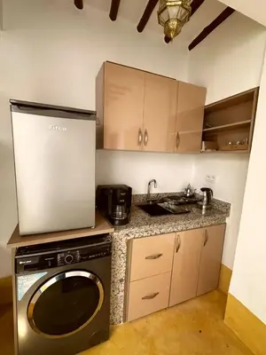 a kitchen with a washing machine and a sink at Little 24 in Marrakech