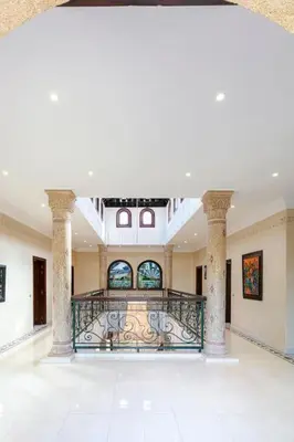 a large room with a balcony in a building at Villa Dar Sultan - Marrakech in Marrakech