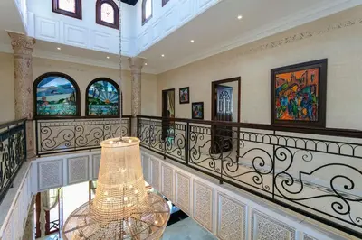 a room with a staircase with a lamp on it at Villa Dar Sultan - Marrakech in Marrakech