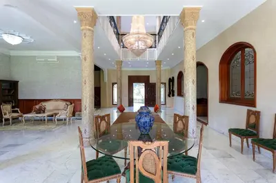 a large room with a glass table and chairs at Villa Dar Sultan - Marrakech in Marrakech