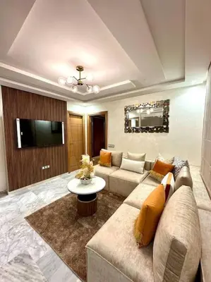 a living room with a couch and a tv at appartement à Gueliz in Marrakech