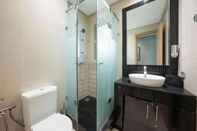 a bathroom with a shower and a toilet and a sink at Relax Front Of Pool-Golf-Atlas in Marrakech