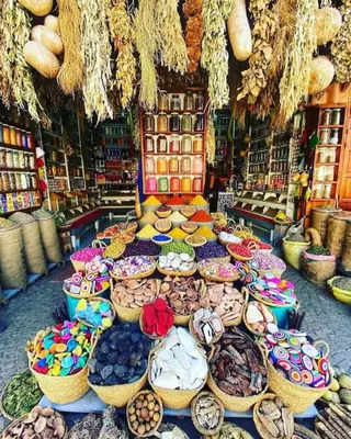 a store filled with lots of baskets of food at Luxury Odyssey - Marrakech Centre in Marrakech