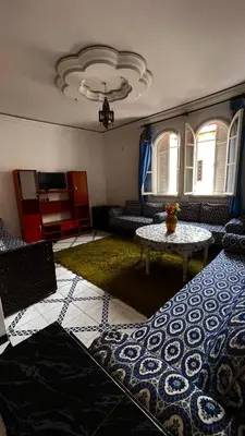 a living room with a couch and a table at Residence Koutoubienne in Marrakech