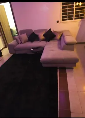 a purple couch sitting in a living room at Appartement de luxe à louer in Marrakech