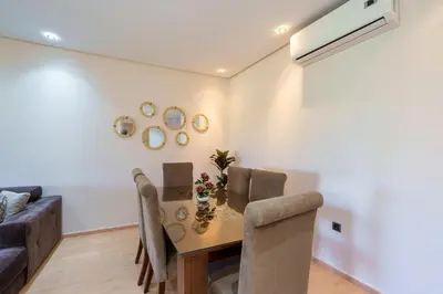 a living room with a table and a couch at Green Side Golf 3 B.R Apartment in Marrakech