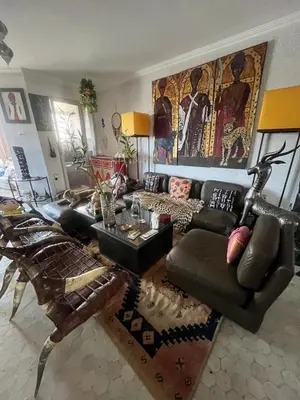 a living room with a couch and a table at Penthouse Jaccuzi Atlas Marrakech in Marrakech