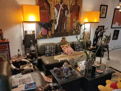 a living room with a couch and a table at Penthouse Jaccuzi Atlas Marrakech in Marrakech