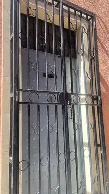 a door with iron bars on a building at Appartement MSholidays Gazelle Marrakech in Marrakech