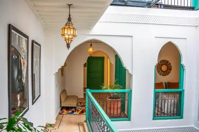 a hallway of a house with a green door at Riad Bella Kasbah in Marrakech