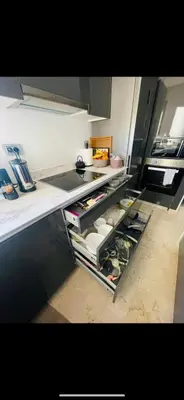 a kitchen with an open refrigerator filled with food at Prestigia Golf Vue Atlas et Piscine in Marrakech