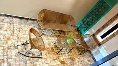 an overhead view of a table and chairs on a tile floor at Luxurious Villa with private pool, Jacuzzi & Cuisinière in Marrakech