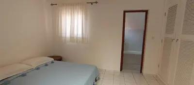a bedroom with a bed and a window and a mirror at Riad Sun and Swim Marrakech in Marrakech