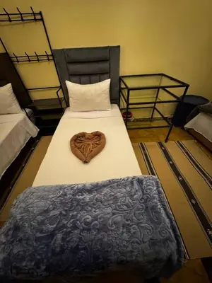 a bedroom with a bed with a heart on it at Riad Lwalidin in Marrakech