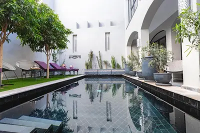 a swimming pool in the middle of a house at Riad Sybil Boutique Hotel in Marrakech