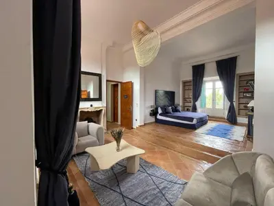 a living room with a couch and a table at Villa Prestige Mansourya in Marrakech