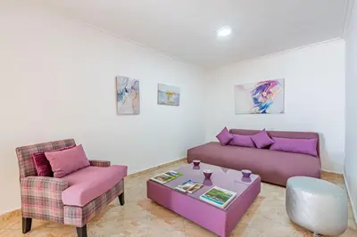 a living room with a couch and a table at Cosy apartment in the heart of Hivernage in Marrakech