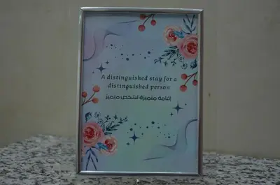 a picture of a sign with flowers on it at Riad Bollywood- family charm in Benguerir