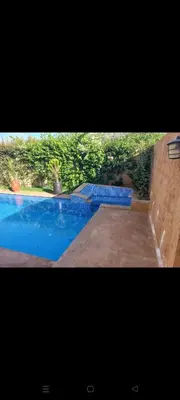 a picture of a swimming pool with blue water at H Amelkis in Marrakech